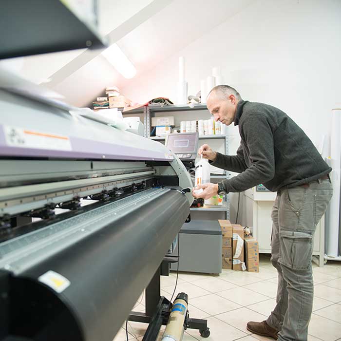 Man working on printer